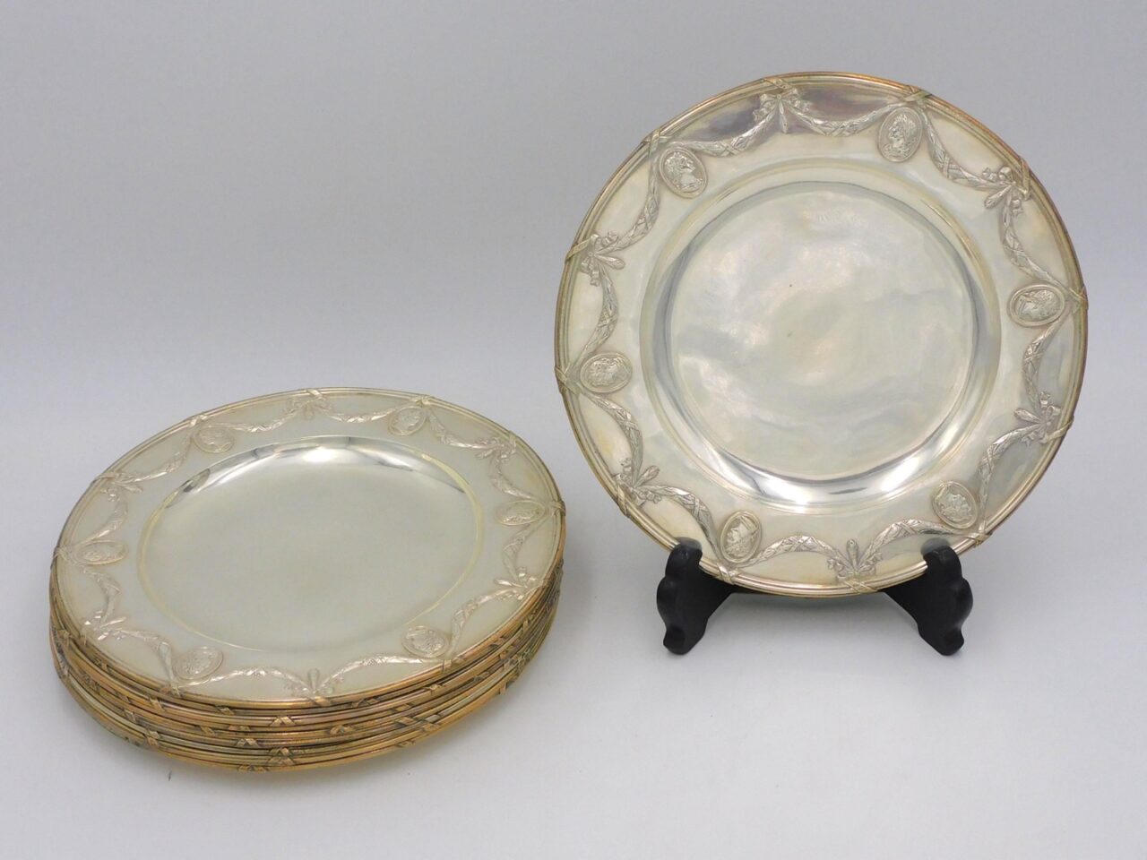 European Silver Plates by Unknown Artist. 19th century. .930 silver with swag and cameo design border. 8 1/4" diameter