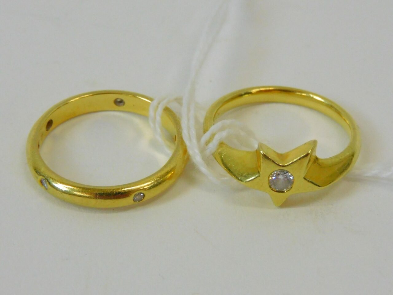 Two Gold and Diamond Rings by Unknown Artist. 20th Century. Eternity Band and Solitaire Ring in Star Design. Size 6.