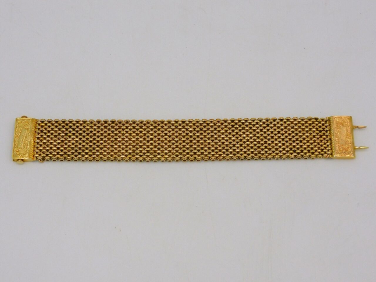 Gold Mesh Bracelet by Unknown Artist. 20th Century. Engraved clasp