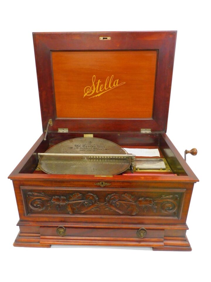 Late 19th Century Victorian Stella Music Disc Player with Carved Mahogany Case and 80 Discs.