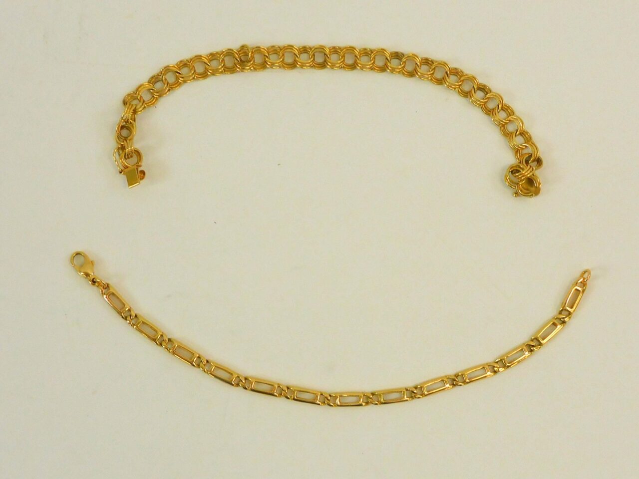 Two 14kt Yellow Gold Designer Bracelets by Unknown Artist. 20th century. Link design. 7" length. 14.4 dwt.