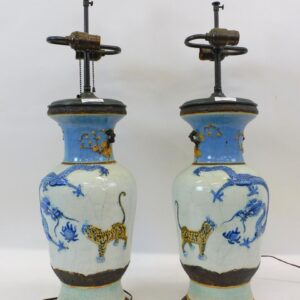 Pair of Chinese Export porcelain dragon and tiger motif vases mounted as lamps