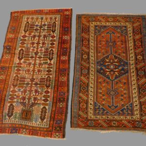 Two Antique Oriental Rugs by Unknown Artist. Early 20th century. Cream field with tree design and geometric centerfield design.