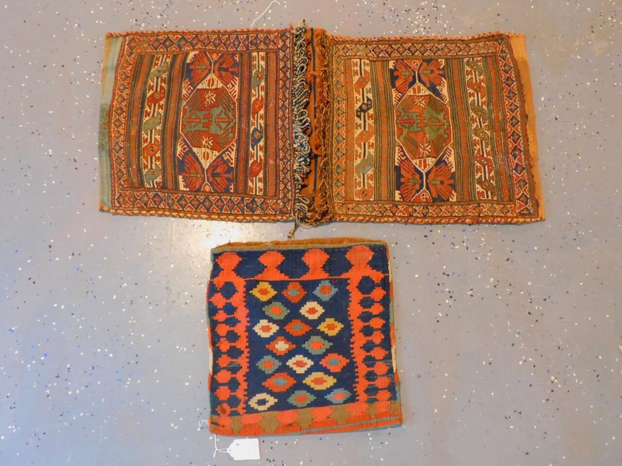 Pair of Oriental Saddle Bags by Unknown Artist. Early 20th century. Sumak and Kilim with geometric and striped designs.