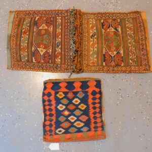 Pair of Oriental Saddle Bags by Unknown Artist. Early 20th century. Sumak and Kilim with geometric and striped designs.