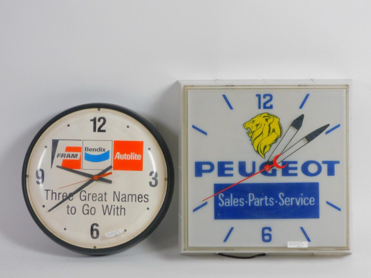 Vintage Advertising Clocks by Peugeot and Fram Bendix Auto Lite