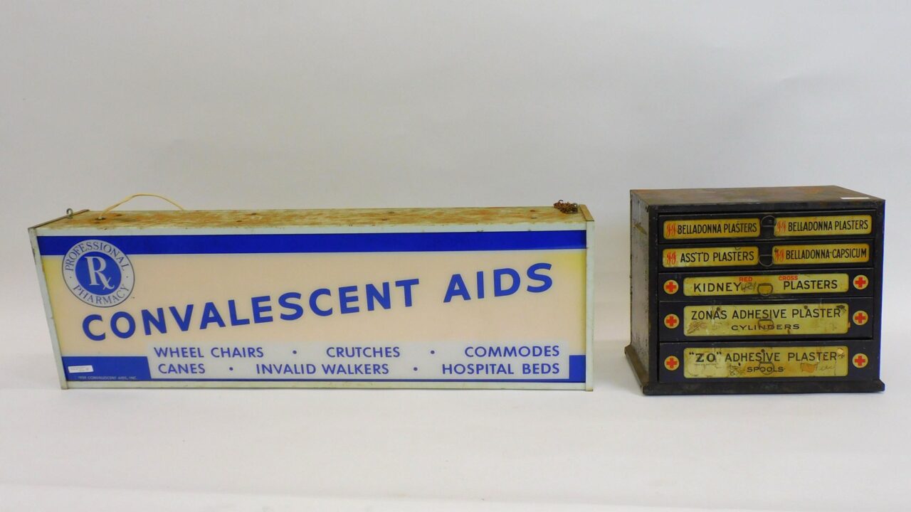 1959 Illuminated Convalescent Aids Sign & Early 20th Century First Aid Metal Cabinet in Auction Catalog.