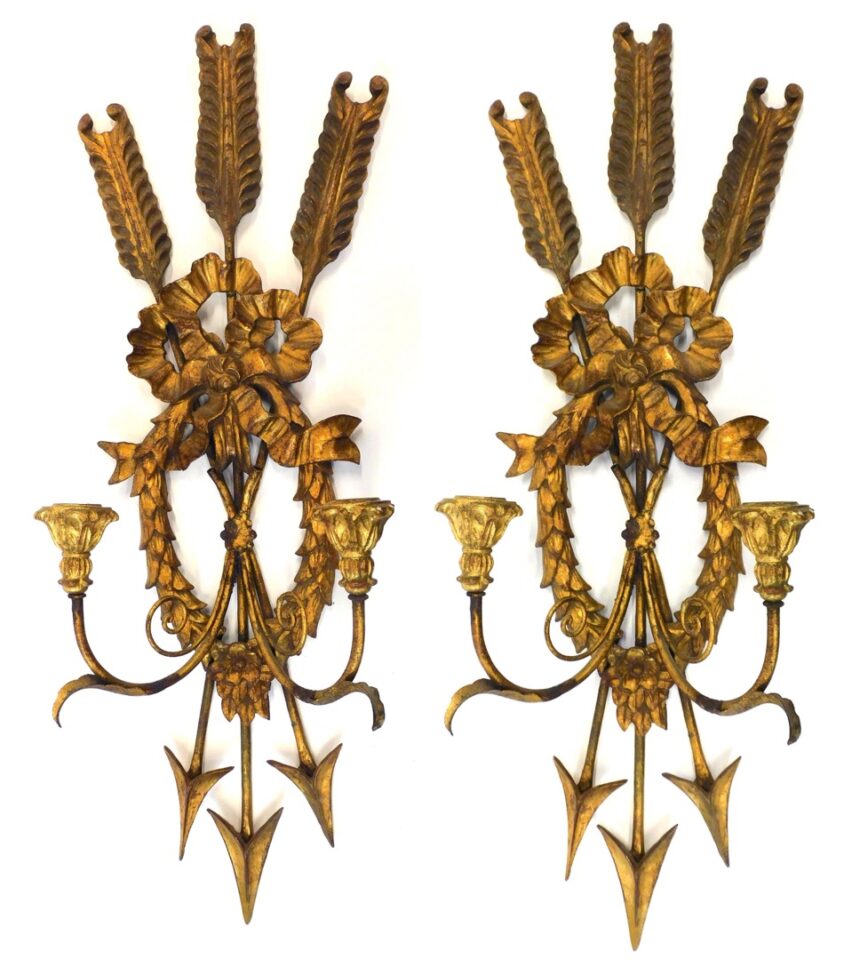 Pair of Regency-revival sconces by Unknown Artist. Early 20th century. Carved wood and gesso with gilt finish. Arrow