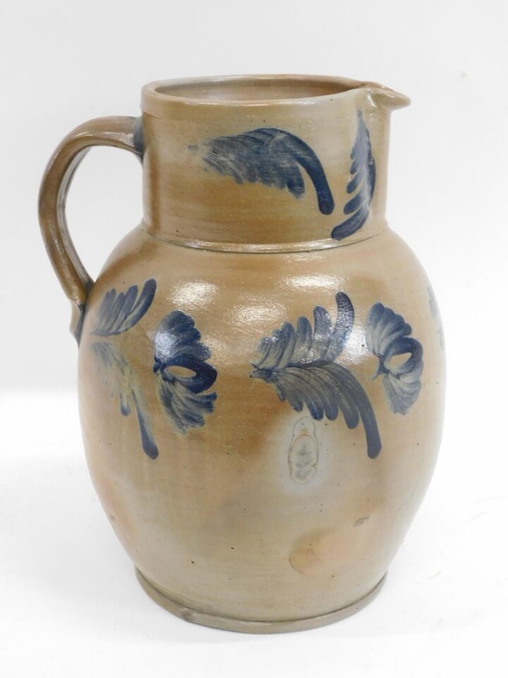 19th Century Pennsylvania Stoneware Pitcher with Blue Floral Spray Paint Design