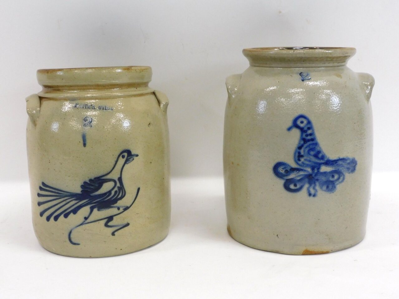 Two Stoneware Crocks with Blue Bird Decoration by Whites