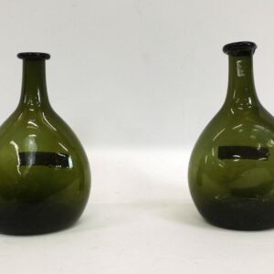 Early blown chestnut glass bottles by unknown artist