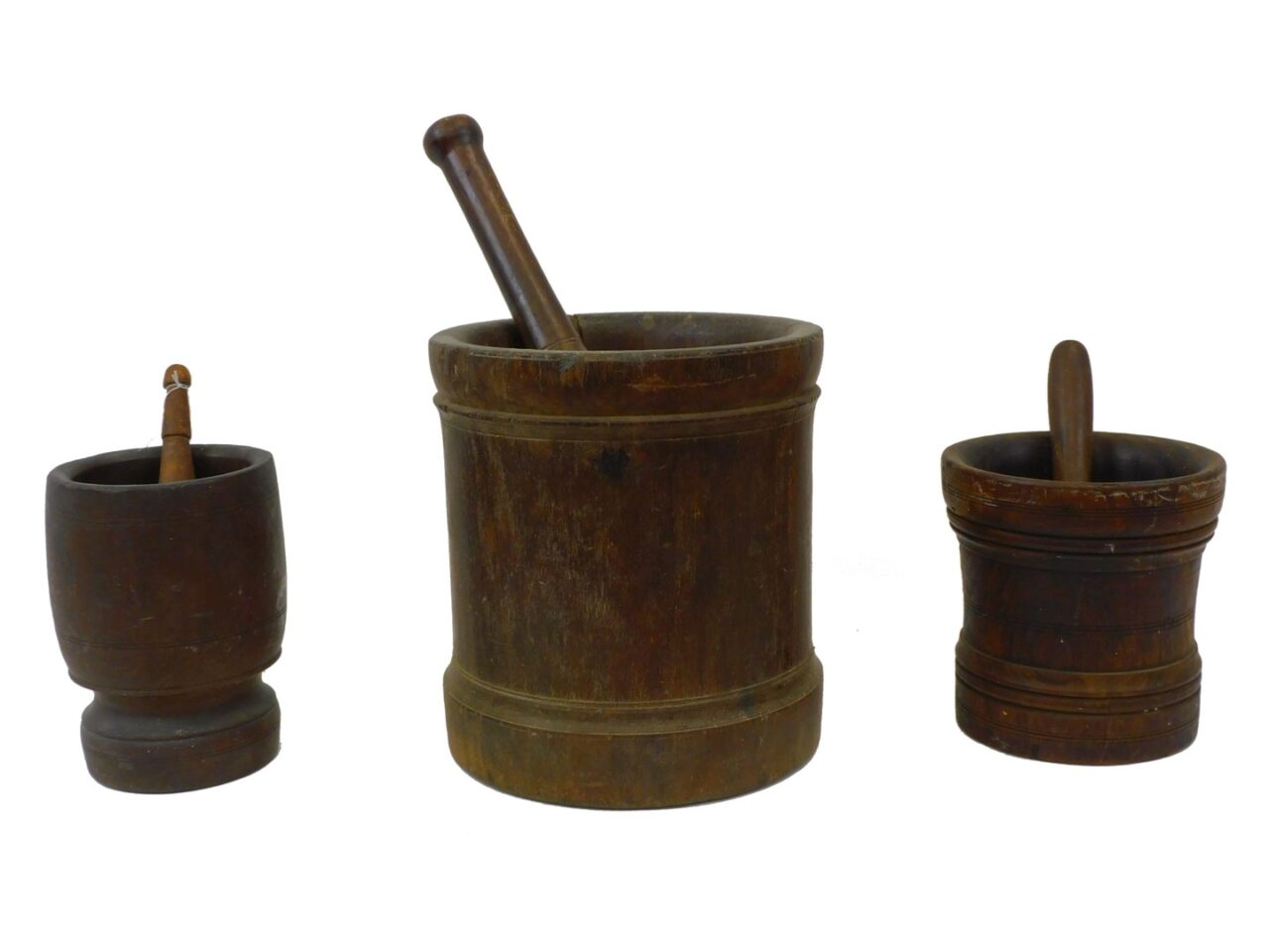 Three Antique Mortar and Pestles by Various Artists