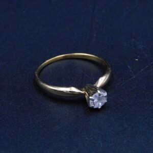 14K Gold And Diamond Solitaire Ring by Unknown Artist. Yellow gold. Small diamond. Size 6 3/4". 0.9 dwt.