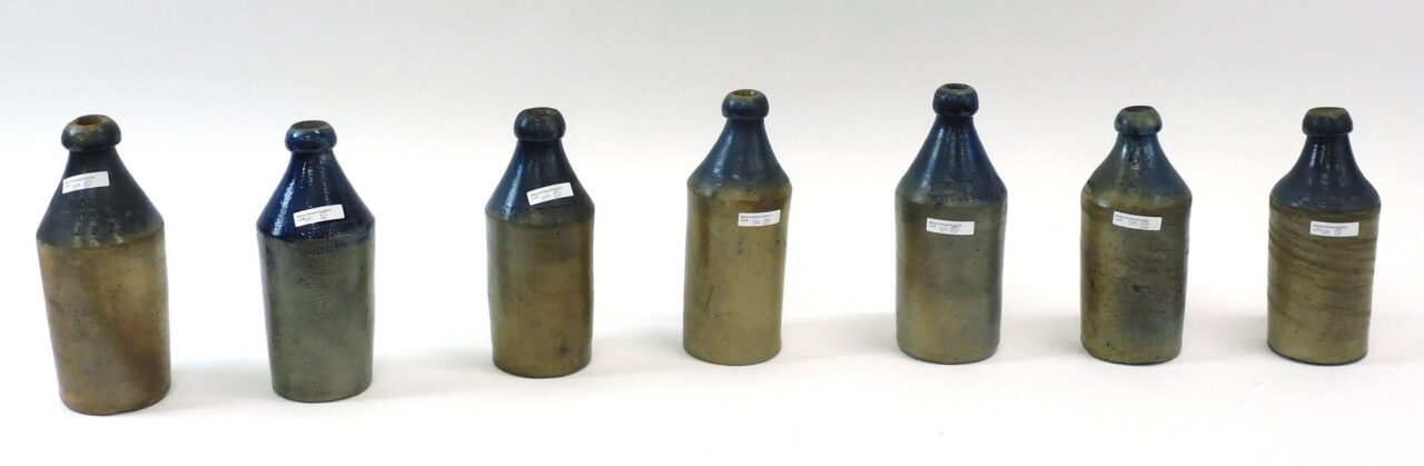 Assorted Cobalt Blue Beer Bottles by H. Young