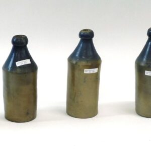 Assorted Cobalt Blue Beer Bottles by H. Young