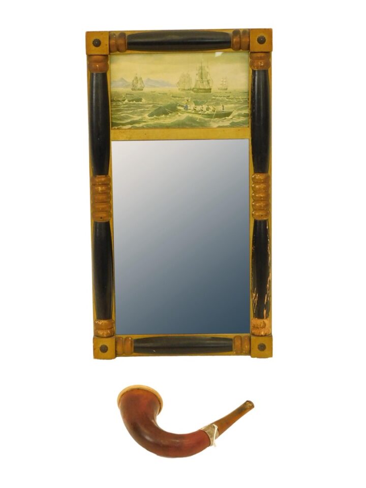 A Wall Mirror And Smoking Pipe