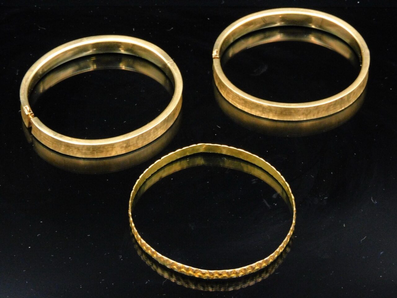 Three Gold Bangle Bracelets