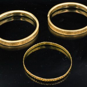 Three Gold Bangle Bracelets