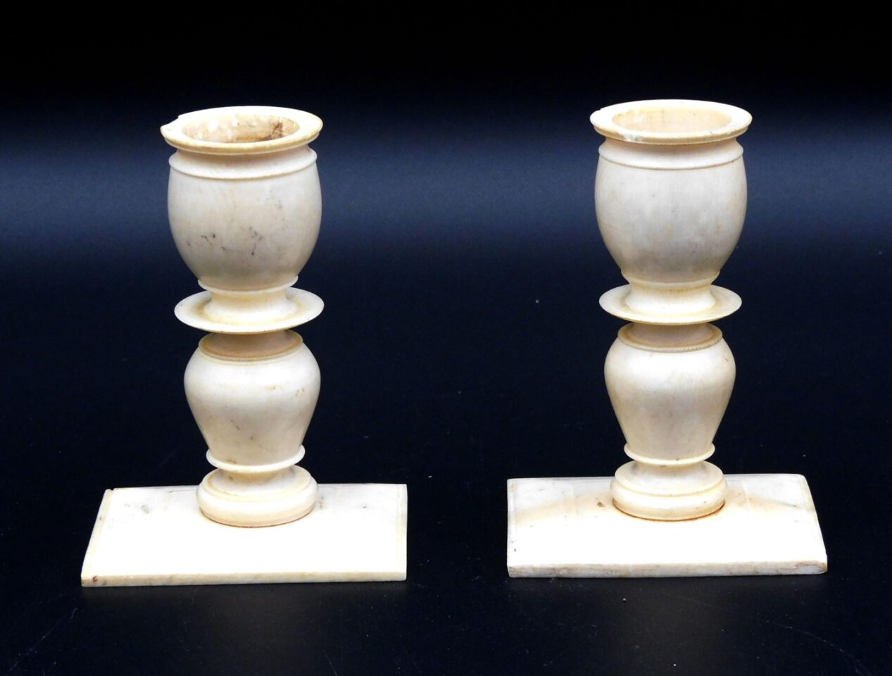 Pair of Scrimshaw Candle Holders by Unknown Artist. 19th c. whale skeletal bone urn-form